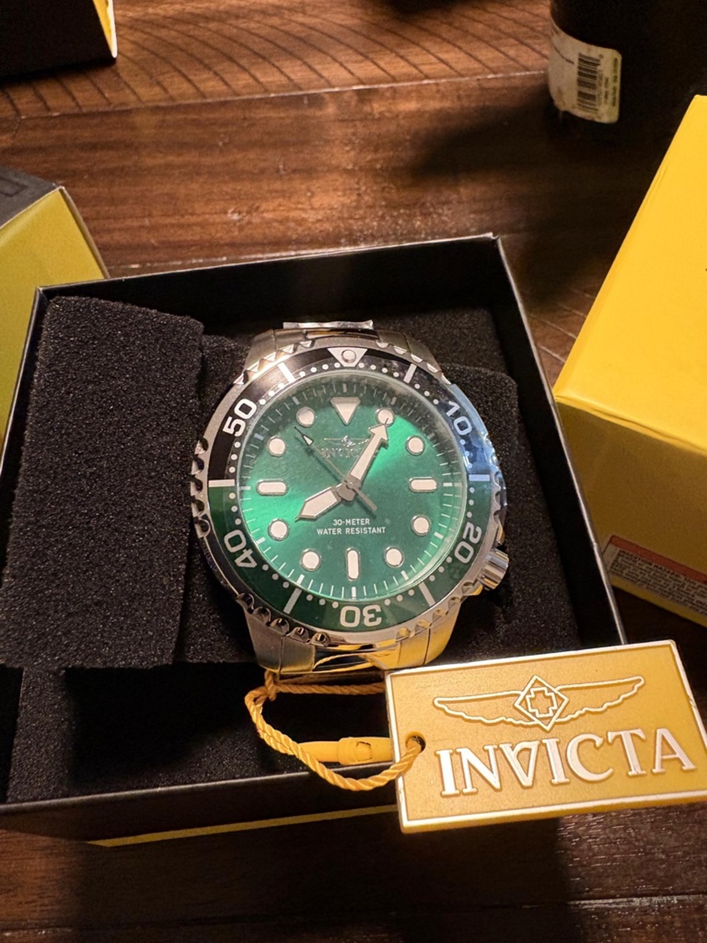 Invicta Silver Watch with Green Dial and Black Bezel
